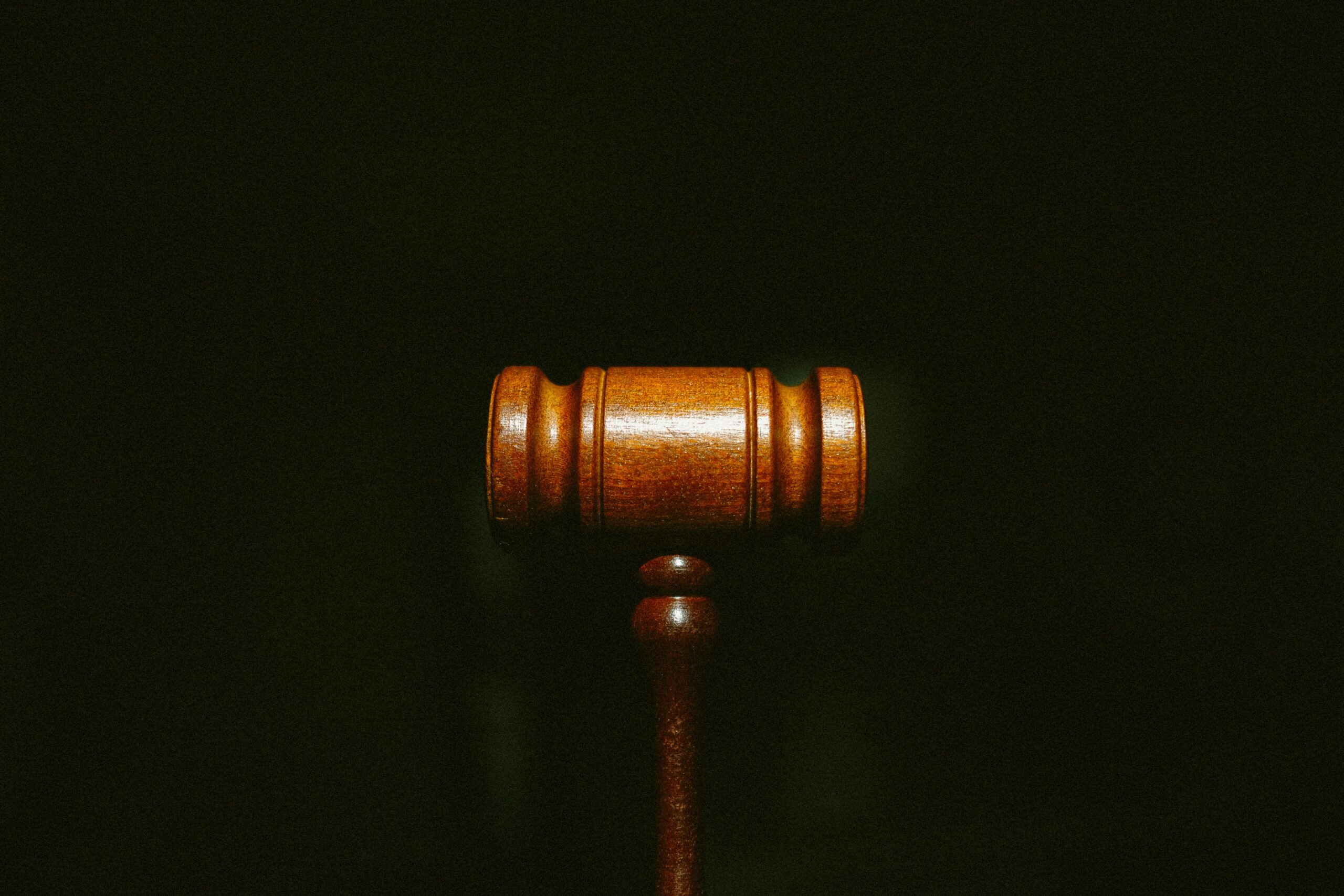 tingey-injury-law-firm-nSpj-Z12lX0-unsplash A gavel set on a black background