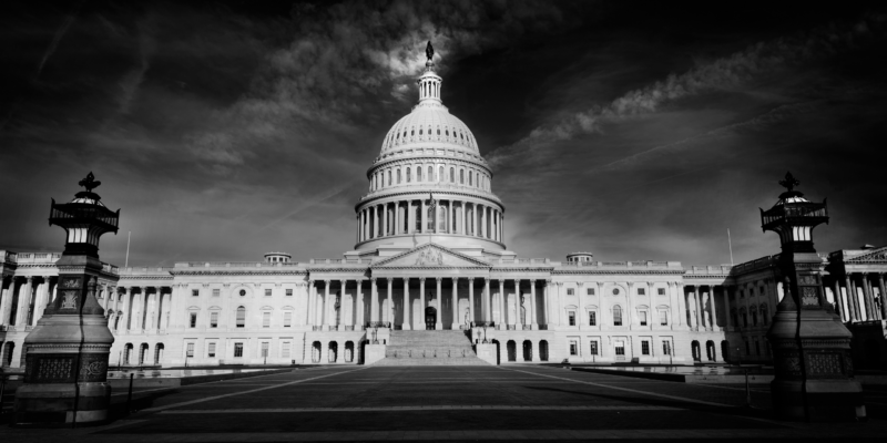 A black-and-white photo of the U.S. Capitol Building.