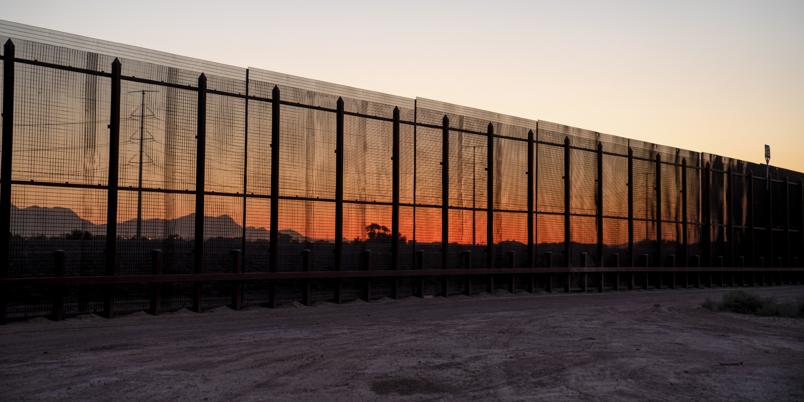 U.S.-Mexico Border A section of the fence separating the U.S. in Mexico at sunset.