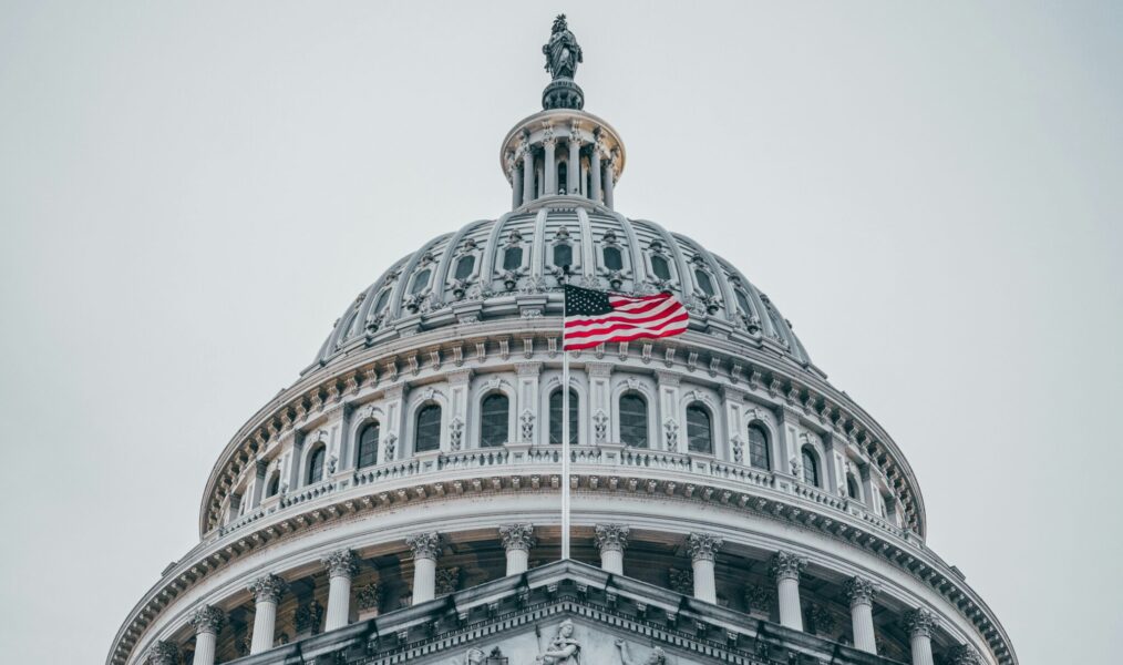 Close-up of the U.S. Capitol with a centered American flag