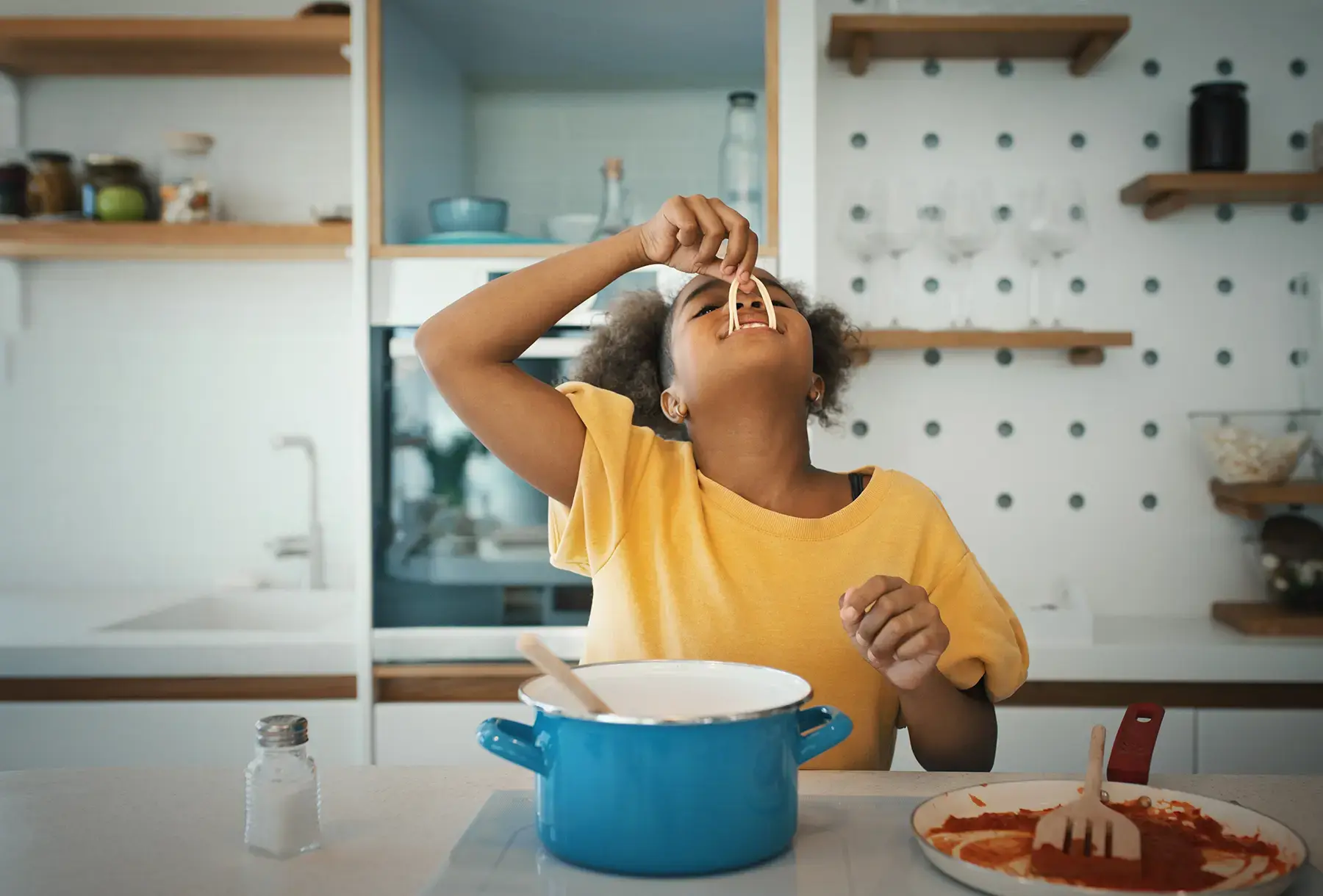 Induction stoves can cook food without warming the kitchen, a benefit in the summer. (gilaxia / Getty Images)